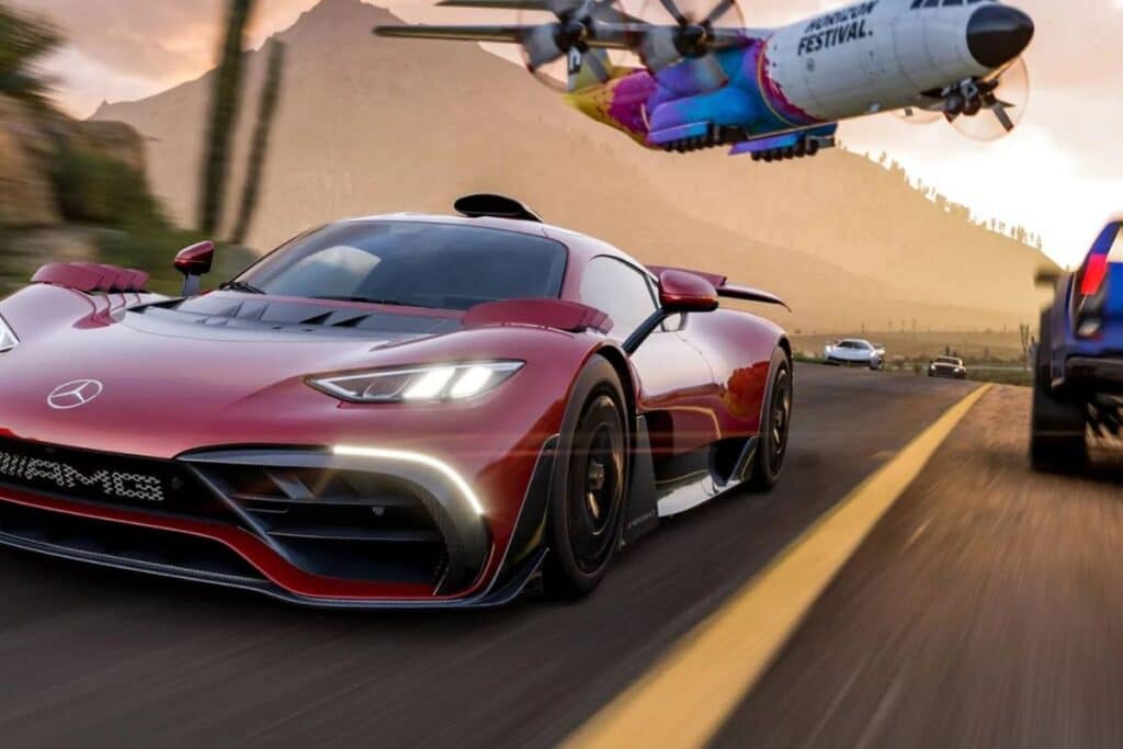 Voiture de sport rouge sur autoroute, avion au-dessus.