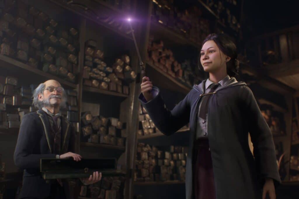 Personne tenant une baguette magique lumineuse.