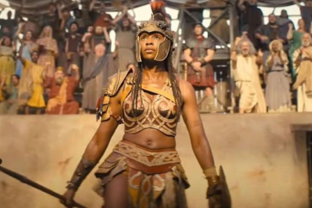 Guerrière vêtue d'une armure dans une arène.