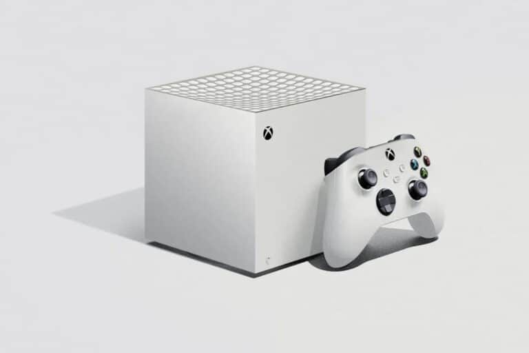 Console de jeu blanche avec manette, design minimaliste.