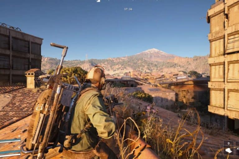 Joueur au sommet, montagne en arrière-plan.