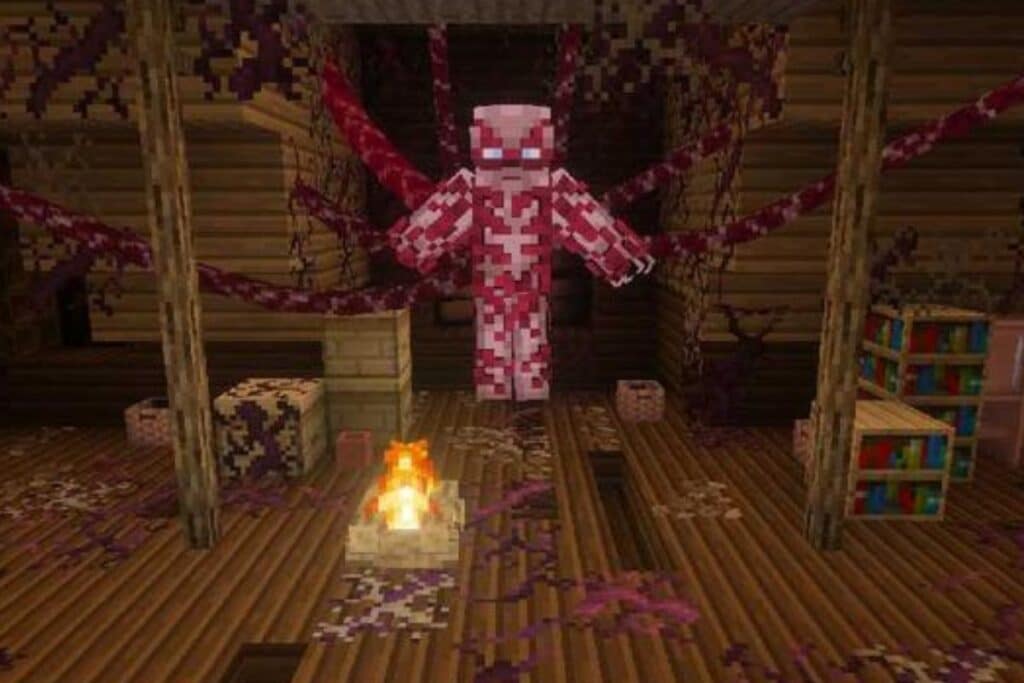 Personnage pixelisé rose flottant dans une pièce sombre.