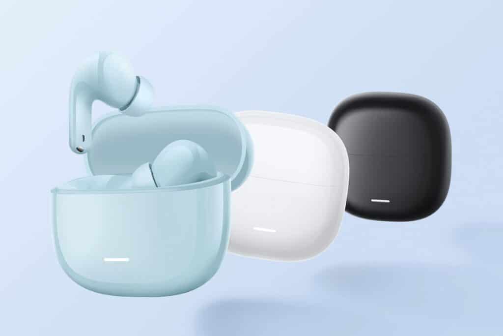 Trois étuis écouteurs sans fil, bleu, blanc, noir.