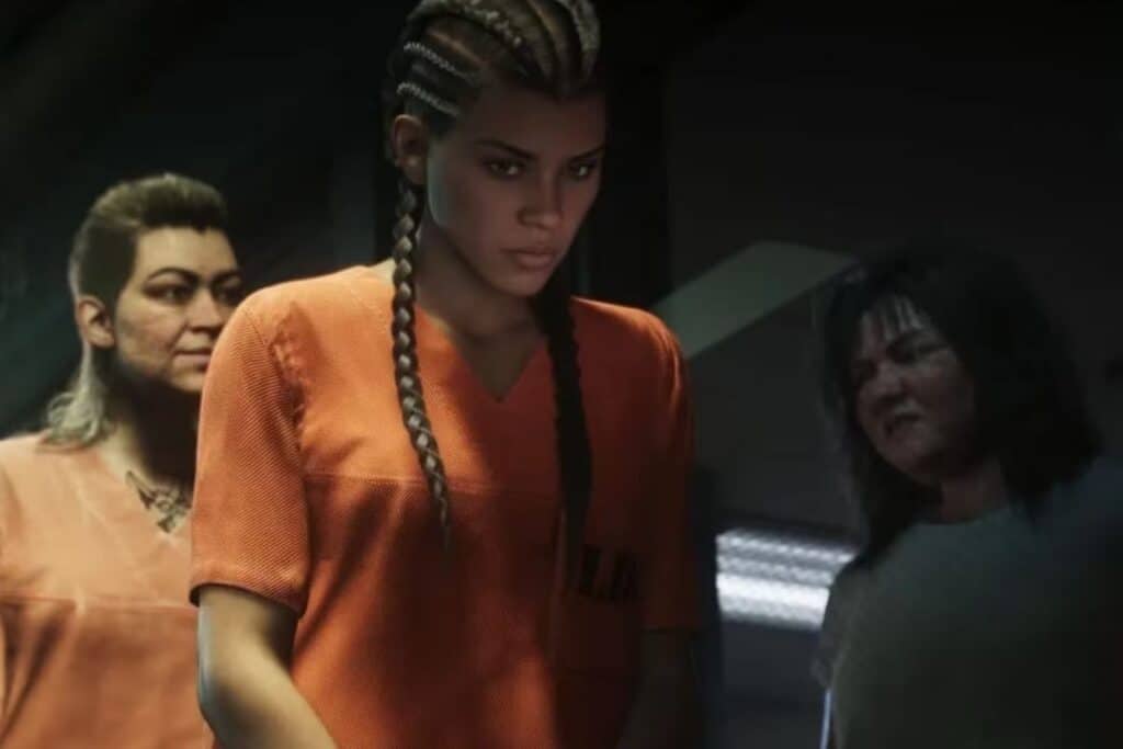 Personnes en uniforme orange dans une scène sombre.