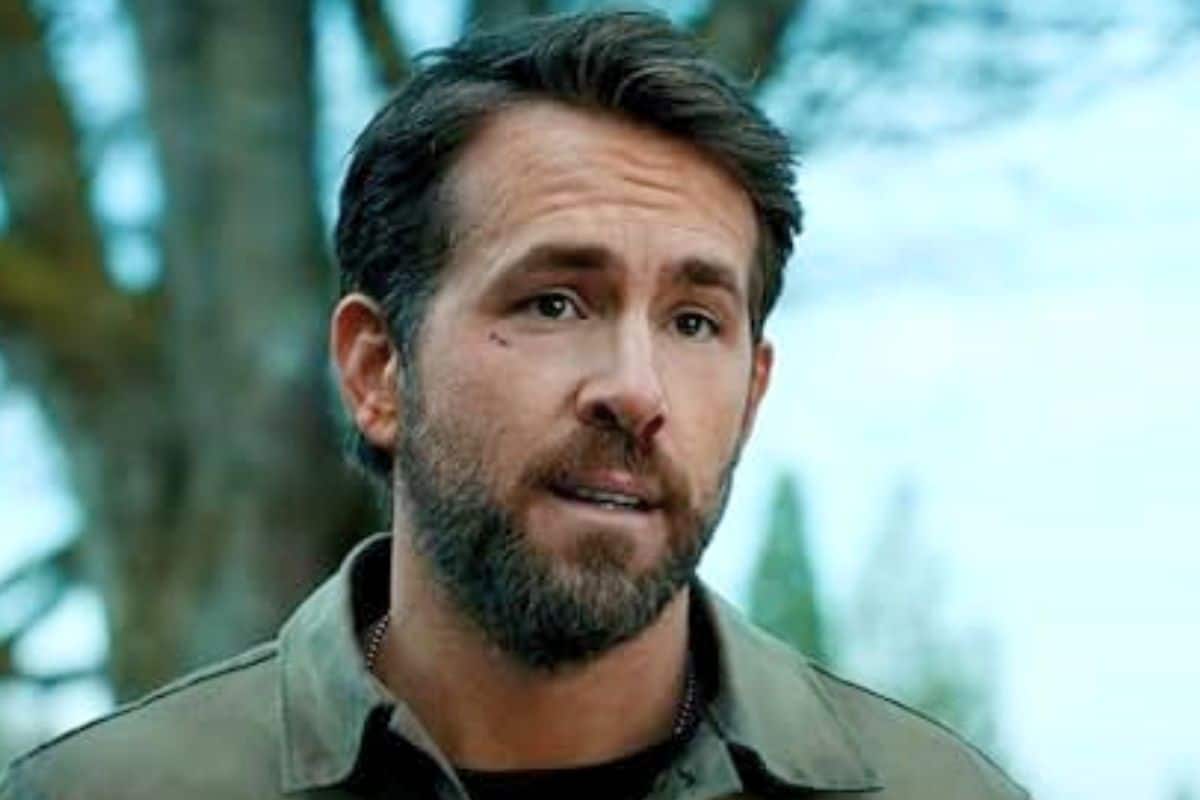 Homme avec une barbe et une chemise verte