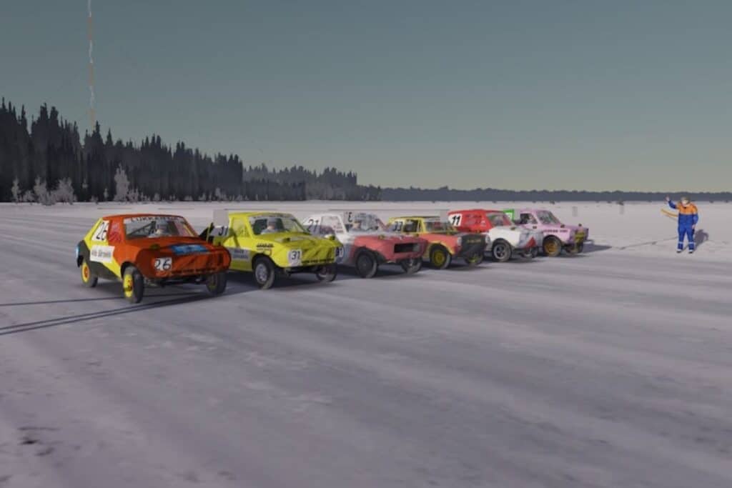 Voitures de course alignées sur une piste enneigée.