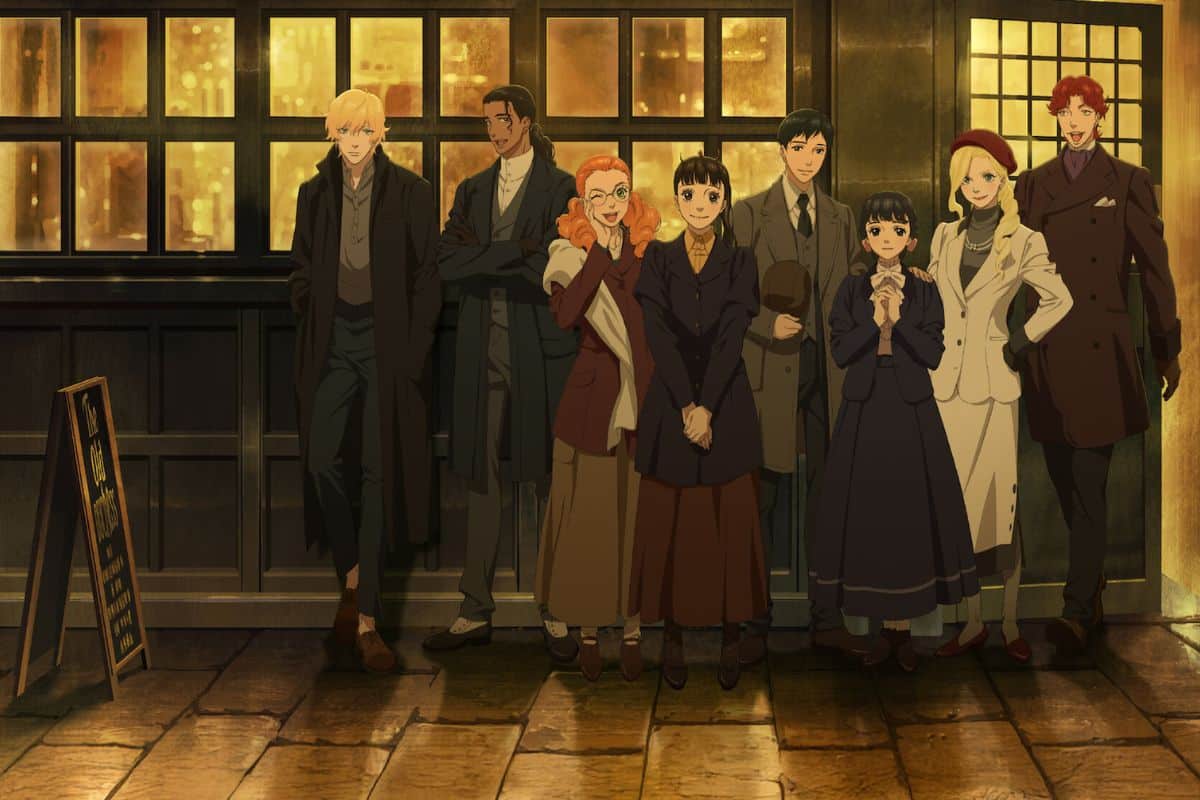 Groupe de personnes posant devant un café.