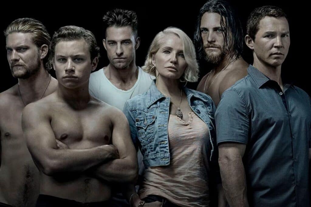 Groupe de personnes posant, ambiance sérieuse.