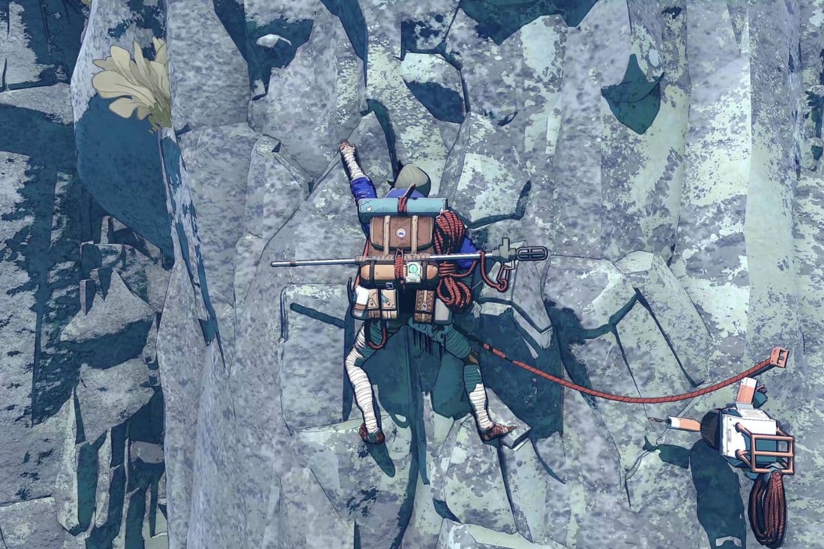 Alpiniste grimpe une paroi rocheuse escarpée.